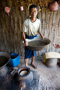 Distilling fermented sugars made from the toddy.